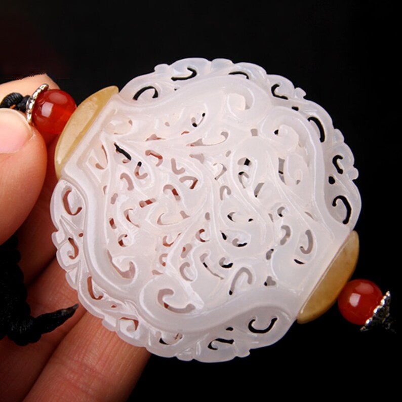hollow engraving flower pattern white nephrite round oblate shape sachet jade carving pendant