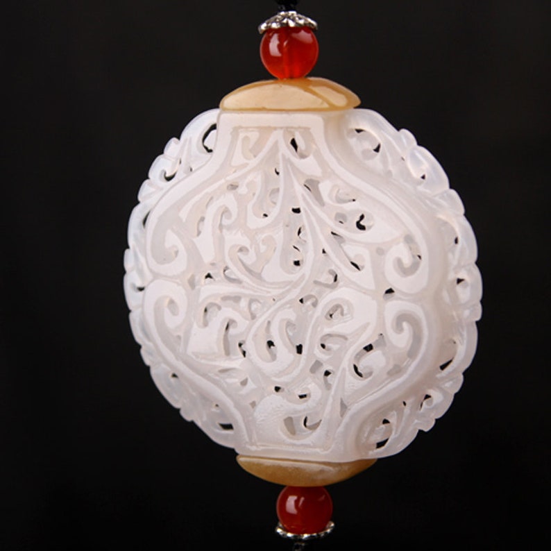 hollow engraving flower pattern white nephrite round oblate shape sachet jade carving pendant
