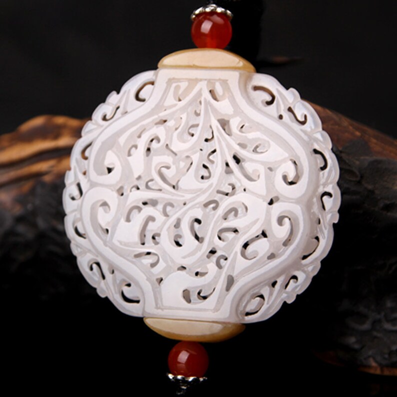 hollow engraving flower pattern white nephrite round oblate shape sachet jade carving pendant