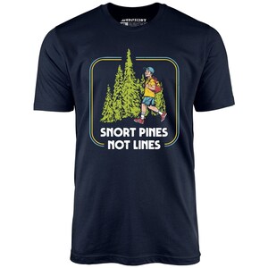 May include: A navy blue t-shirt with a retro-style graphic of a person walking through a forest of pine trees. The text "Snort Pines Not Lines" is printed below the graphic.
