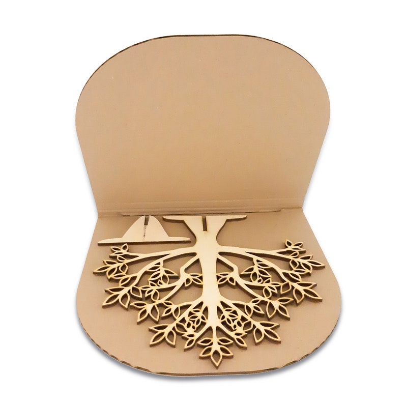 The jewelry tree is packed in a cardboard box. It is disassembled in parts. The light tree of the jewelry holder is made of wood. The jewelry tree has holes for stringing earrings.
