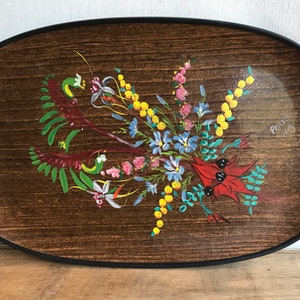 May include: An oval wooden serving tray with black edging and bamboo handles. The tray features a hand-painted floral design with red, yellow, blue, and green flowers. The words "Perth W.A." are painted in black on the tray.