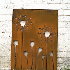 May include: A rusty metal garden screen featuring a design of stylised dandelions. The screen is rectangular and has a brown, rusty finish.