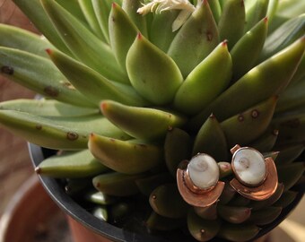 Copper earrings and Santa Lucia eyes