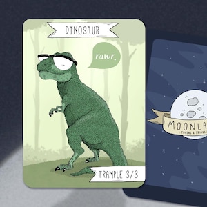 May include: A green dinosaur wearing glasses with a speech bubble that says "rawr." The dinosaur is standing on a green background with trees. The card has the text "Dinosaur" and "Trample 3/3".