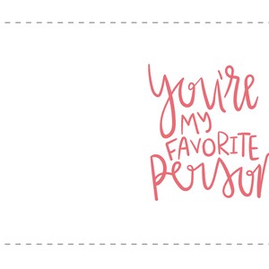 May include: A white card with a pink dashed border and the text "you're my favorite person" written in pink cursive.