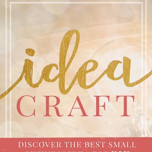 May include: Book cover with a gold textured "idea" and red "CRAFT" text. The cover has a light pink background with a blurred light effect. The text "DISCOVER THE BEST SMALL BUSINESS IDEA FOR YOU" is in red on a pink banner. The author's name, "BY SARAH KORHNAK", is in red at the bottom of the cover.