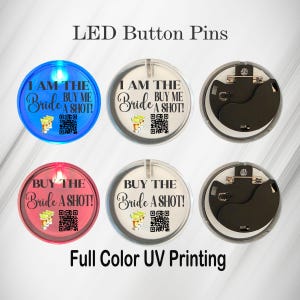 May include: LED button pins with the text "I AM THE Bride BUY ME A SHOT!" and "BUY THE Bride A SHOT!". The pins are round, with a clear plastic cover and a metal pin back. Some pins are blue or red and light up.