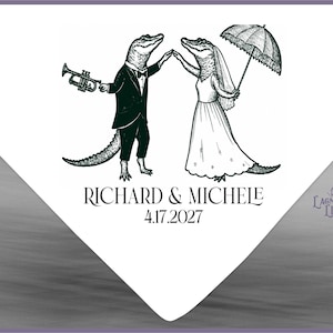 May include: A black and white graphic illustration of two anthropomorphic alligators dressed for a wedding. One wears a tuxedo and holds a trumpet, while the other wears a gown and holds an umbrella. Text reads RICHARD & MICHELE and 4.17.2027.