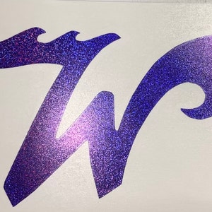 May include: A purple glitter vinyl decal of the letter "W" in a stylized font. The letter is outlined in a wavy design.
