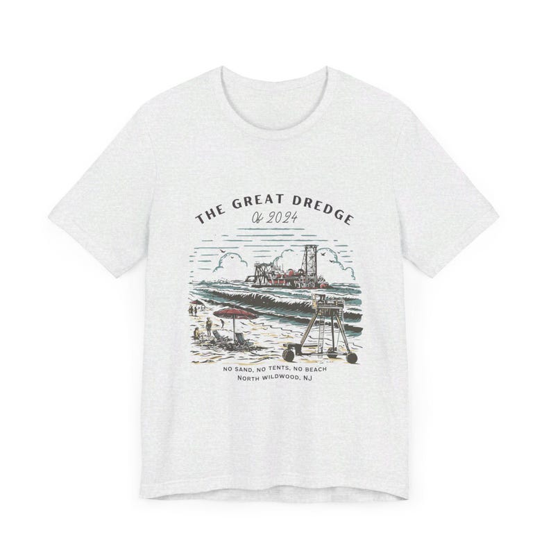 May include: Light gray t-shirt featuring a beach scene with the text "THE GREAT DREDGE of 2024". The graphic includes a beach, ocean, and machinery. The text "NO SAND, NO TENTS, NO BEACH NORTH WILDWOOD, NJ" is also printed on the shirt.