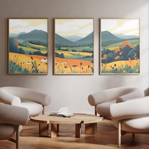 May include: Three framed landscape prints featuring a yellow, green, and blue colour scheme. The prints depict rolling hills, trees, and wildflowers. The prints are hanging on a light beige wall above a wooden coffee table and three white armchairs.