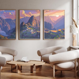 May include: Three framed landscape paintings depicting a mountain range with a village in the foreground. The paintings are hung on a light beige wall above a wooden coffee table and three white armchairs.
