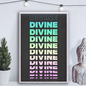 May include: A black and white poster with the word "DIVINE" repeated in a gradient of colors, from teal to pink. The poster has a speckled background and is framed in a white frame.