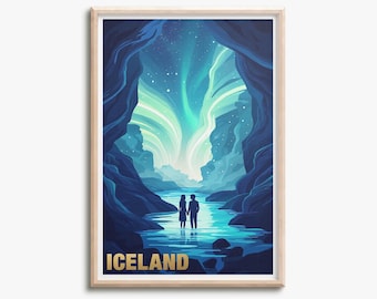 May include: A framed vertical art print featuring a dark blue cave opening that reveals a bright turquoise aurora borealis in the night sky. Two silhouettes stand in the centre of a glowing blue river. The word ICELAND is printed in gold at the bottom.