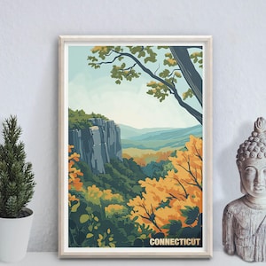 Puede incluir: Una impresión artística enmarcada que representa un paisaje de Connecticut. La obra de arte muestra un acantilado de montaña, árboles verdes y follaje otoñal amarillo y naranja. La palabra "CONNECTICUT" está impresa en la parte inferior.
