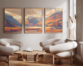 May include: Three framed landscape paintings of a mountain range with a lake in the foreground. The paintings are in a living room setting with two white armchairs and a wooden coffee table.