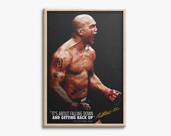 May include: A framed poster featuring a shirtless, bald fighter with tattoos on the arm and abdomen, shouting with intensity. The text reads, "IT'S ABOUT FALLING DOWN AND GETTING BACK UP" with a signature below, "Ruthless RL" and "RUTHLESS ROBBIE LAWLER."
