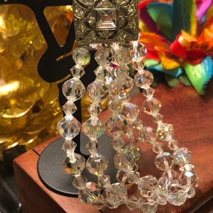 Three strand crystal Bracelet silver tone lever rhinestone securement.