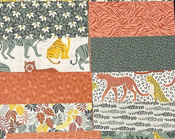 May include: A collection of 10 patterned paper sheets featuring jungle animals, plants, and geometric designs. The papers are in shades of green, brown, yellow, and white.