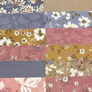 May include: A patchwork of floral fabric swatches in various colors. The patterns include white and yellow flowers on blue, mustard, and pink backgrounds. Some swatches have solid colors like blue and tan.