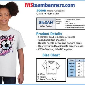 May include: White youth t-shirt with a pink and purple soccer ball graphic and the name "Jackie" in black text. The shirt is a Gildan Ultra Cotton 2000B Classic Fit Youth T-Shirt.