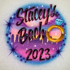 Airbrush T-shirt with cityscape and diamond ring