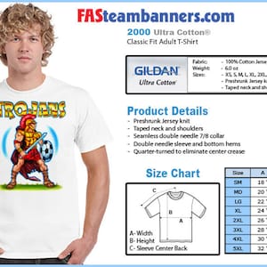 May include: White t-shirt with a graphic of a cartoon Trojan warrior holding a sword and soccer ball. The shirt is a Gildan Ultra Cotton 2000 Classic Fit Adult T-Shirt. The text "TROJANS" is printed in black above the graphic. The shirt is available in sizes XS to 3XL.