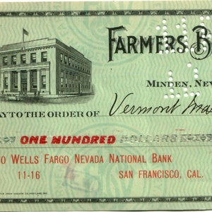 May include: A green cheque with the text "FARMERS BANK OF CARSON VALLEY, INC." and "MINDEN, NEVADA." The cheque is made out to "Vermont Marble Co." for £100.00 and signed by "H. G. Marsh, CASHIER."