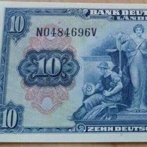 May include: A 1949 ten Deutsche Mark banknote from the Bank Deutscher Länder. The blue and white paper currency features the text Bank Deutscher Länder, the number 10, and the phrase Zehn Deutsche Mark, with an illustration of three figures.