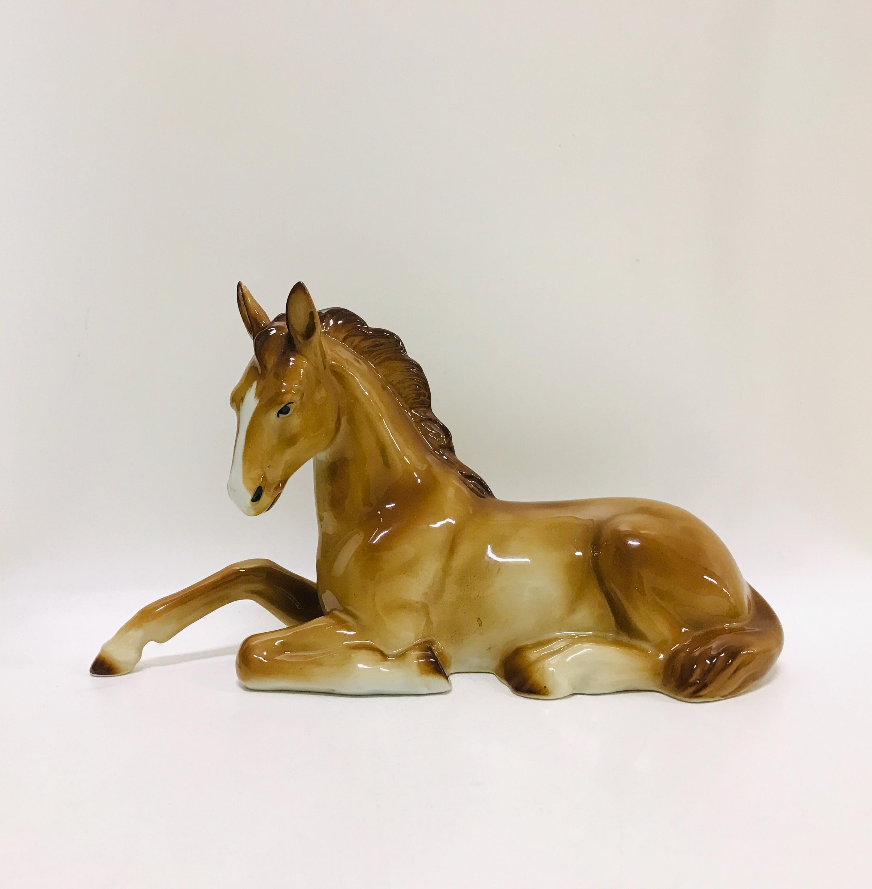 Large porcelain horse figurine from Lippelsdorf, Thuringia, Vintage German ceramic sitting horse sculpture, Made in Germany