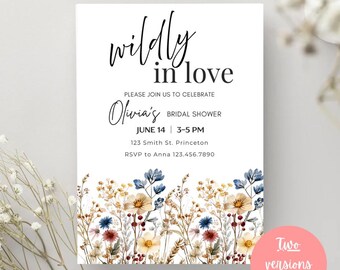 May include: A white invitation card with the text "wildly in love" in black script. The card announces Olivia's bridal shower on June 14th, 3-5 PM, with RSVP information. The bottom features a floral border with blue, yellow, and red flowers.
