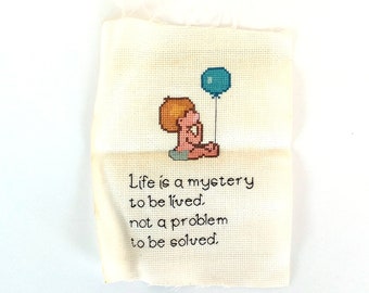 Vintage Cross Stitch Baby Boy with Blue Balloon "Life is a mystery to be lived, not a problem to be solved."