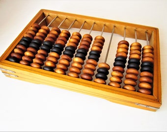 Large Soviet wooden abacus with brown and black wooden moved beads.