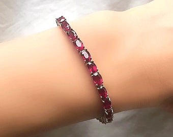 Genuine Ruby Oval 6x4 mm Silver Tennis Bracelet