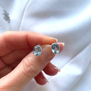 Genuine Sky Blue Topaz Bezel Set Oval Halo 9 x7 mm Silver Stud Earrings
