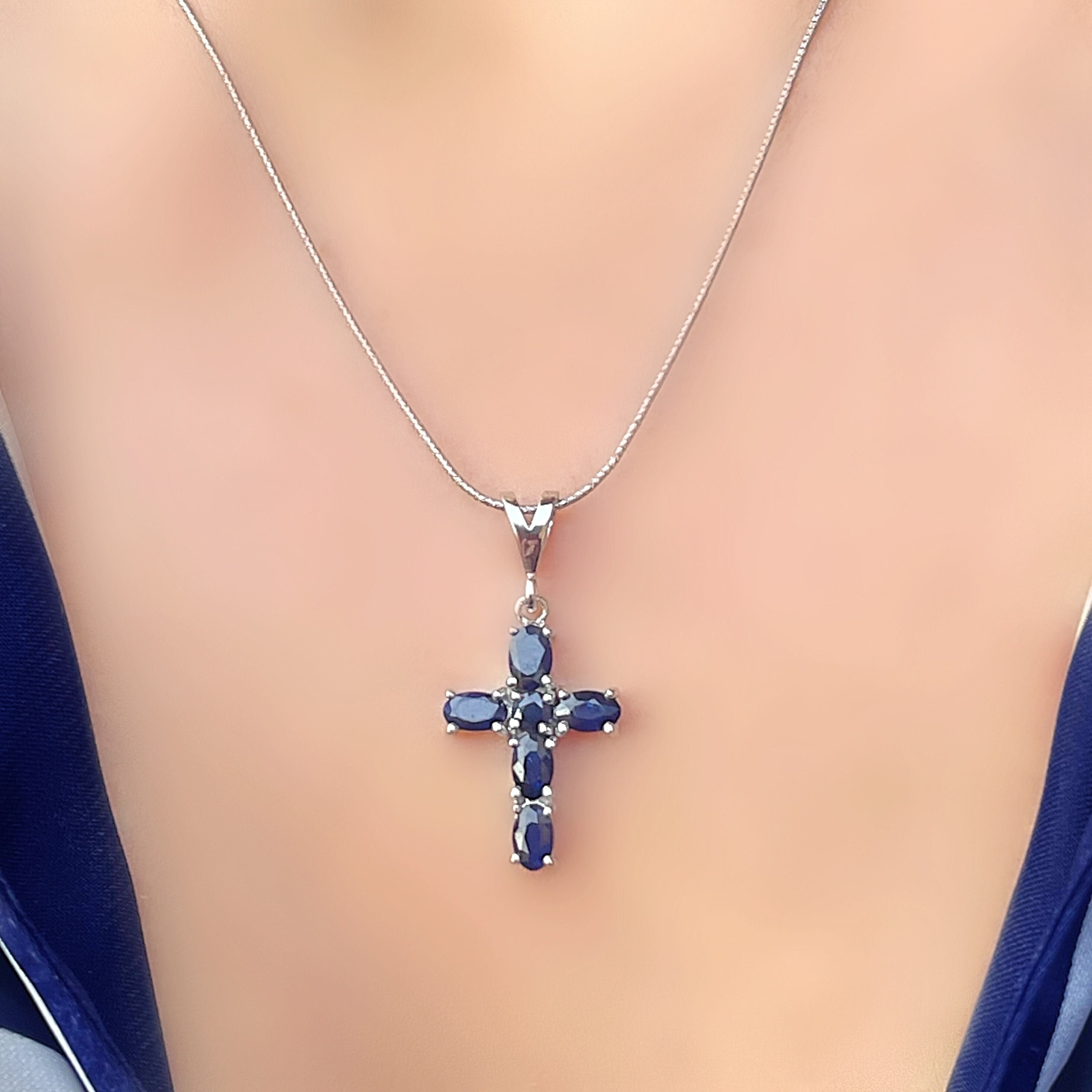 Cross necklace with blue sapphire deals