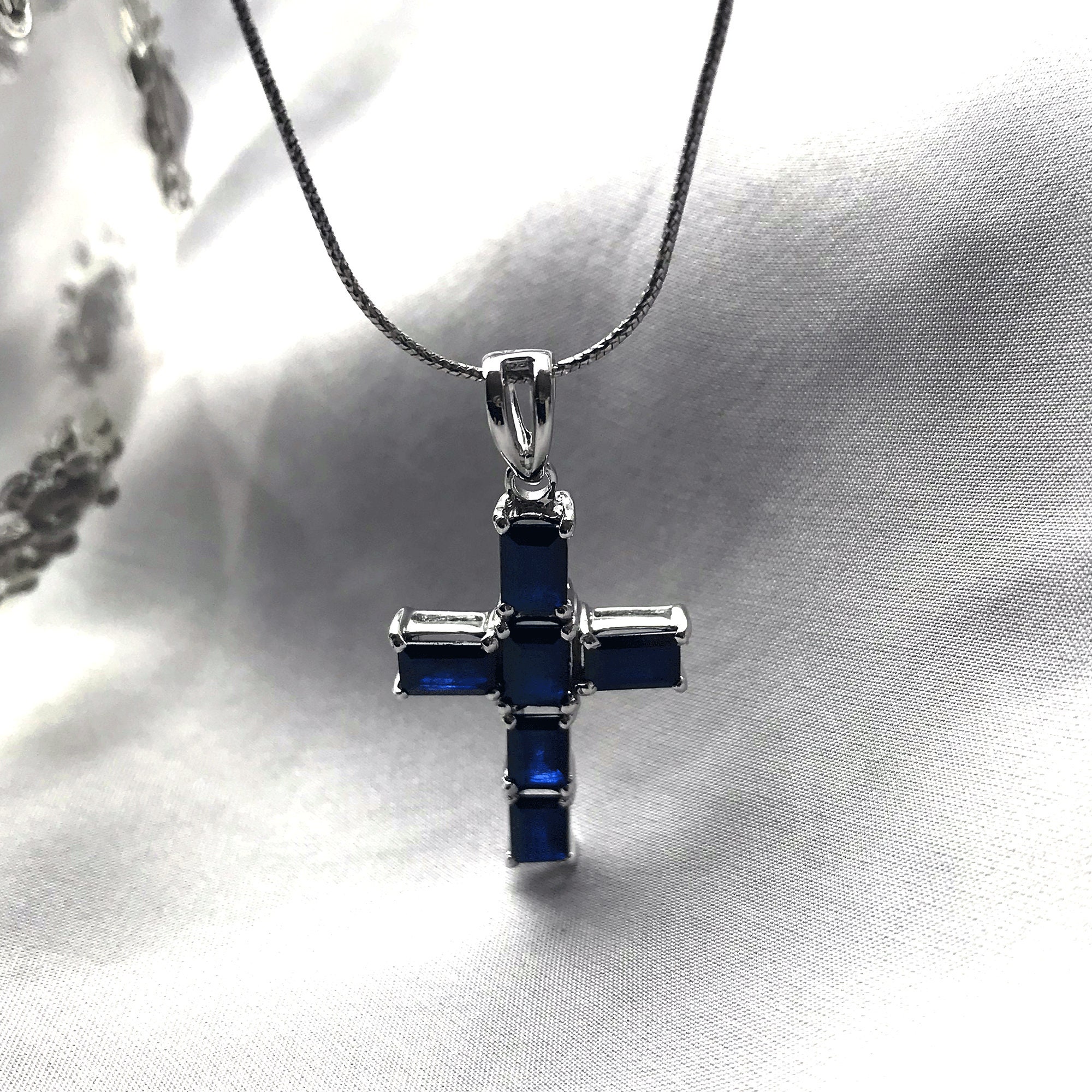 Genuine sapphire cross best sale necklace