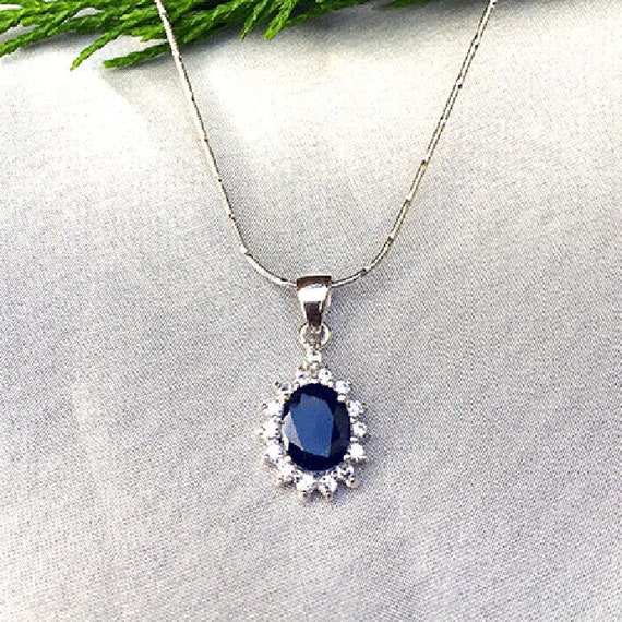 Pendentif nœuds d'amour saphir bleu et diamants pour femme