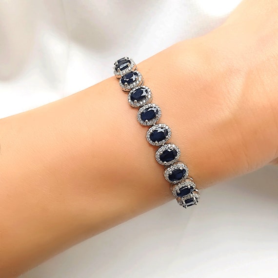 Sterling Silver Genuine Blue Sapphire and White Topaz Round Halo Pendant Sterling Silver Genuine Blue Sapphire and White Topaz Round Halo Pendant