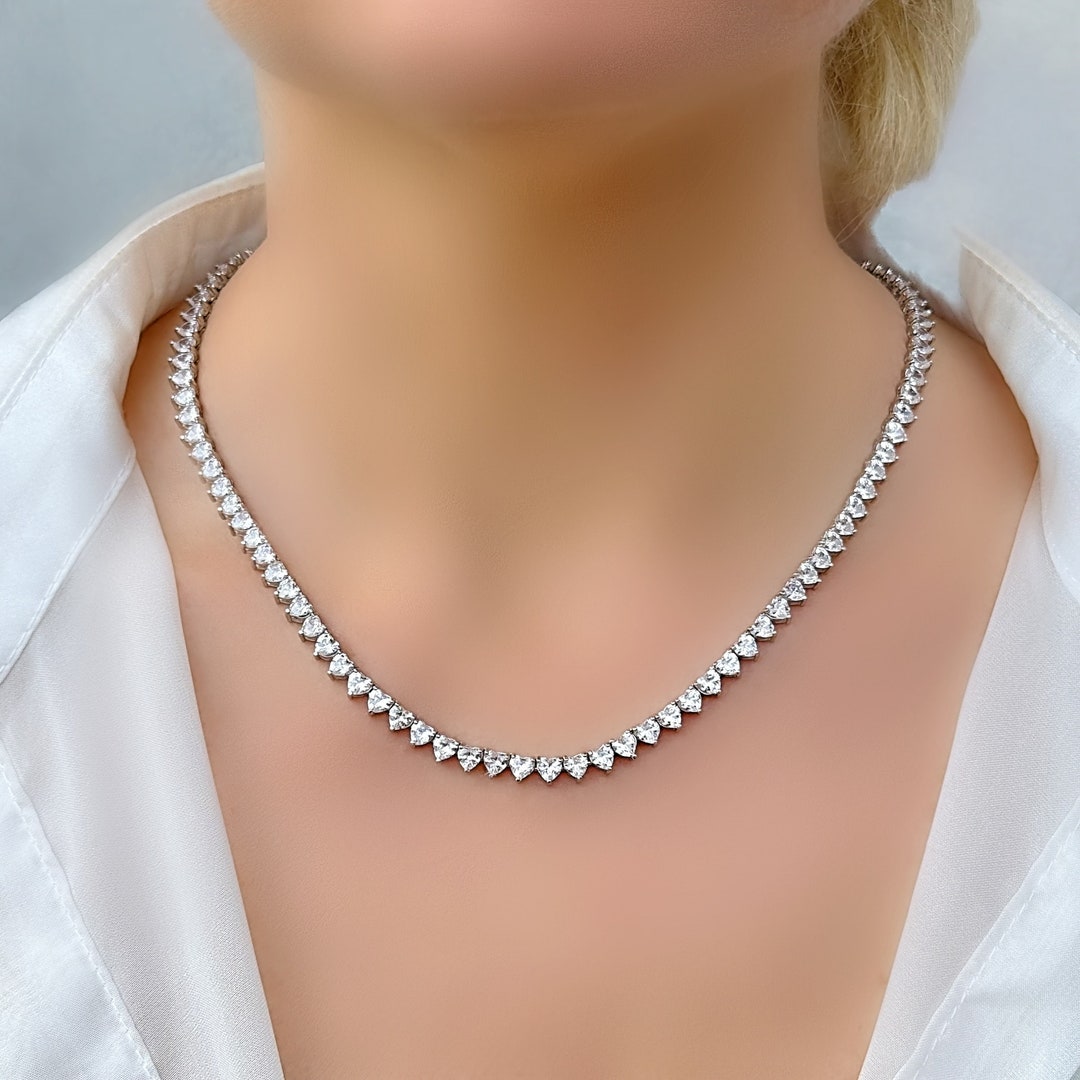 1/10 ctw Swirl Journey Diamond Pendant in 10K White Gold
