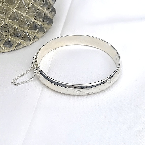 Crossed Arms Silver Bangle Bracelet | Ciclon