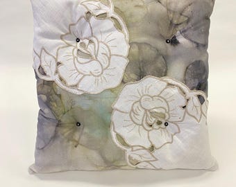 Embroidered flower- throw pillow of originally designed fabric and vintage crocheted lace.