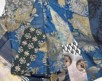 Handmade double-sided silk and cotton pieced scarf. Hues of blue and gold.