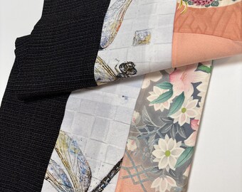 Handmade double-sided silk and cotton pieced scarf. Hues of oranges mixed with black