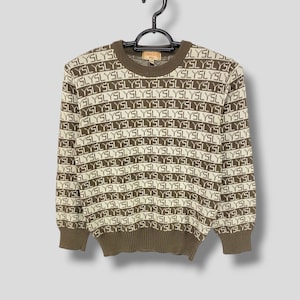 May include: A handmade, wooden cutting board with a natural finish. The board features a live edge on one side and a smooth, rectangular shape. It is approximately 18 inches long and 12 inches wide.