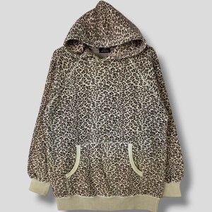 May include: A brown and beige leopard print hoodie with a drawstring hood and two front pockets.