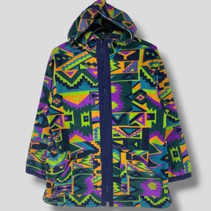 May include: A hooded fleece jacket with a colorful geometric pattern in shades of green, purple, orange, and blue. The jacket has a zipper closure and two pockets.