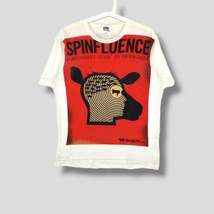 Comme des garcons eYe Junya watanabe spinfluence tshirt Japanese designer propaganda art clothing preppy casual outfit white Medium