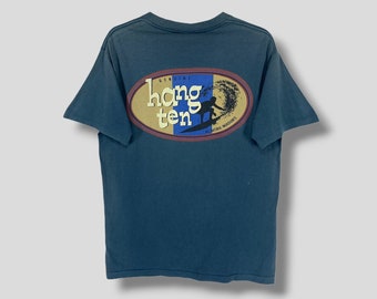 Vintage 90-tals Hang Ten Surfer-logotyp t-shirt surfkläder streetwear casual outfit surftröja enkelsöm grön medium